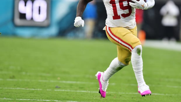 San Francisco 49ers wide receiver Deebo Samuel runs with the football.